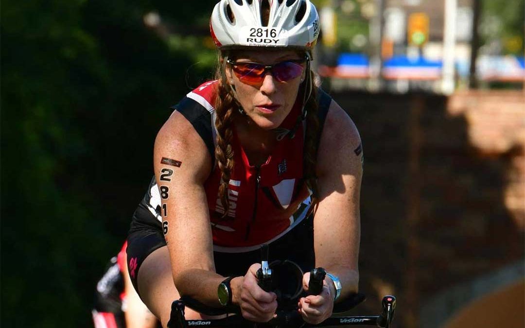 Woman on a bike competing in triathlon